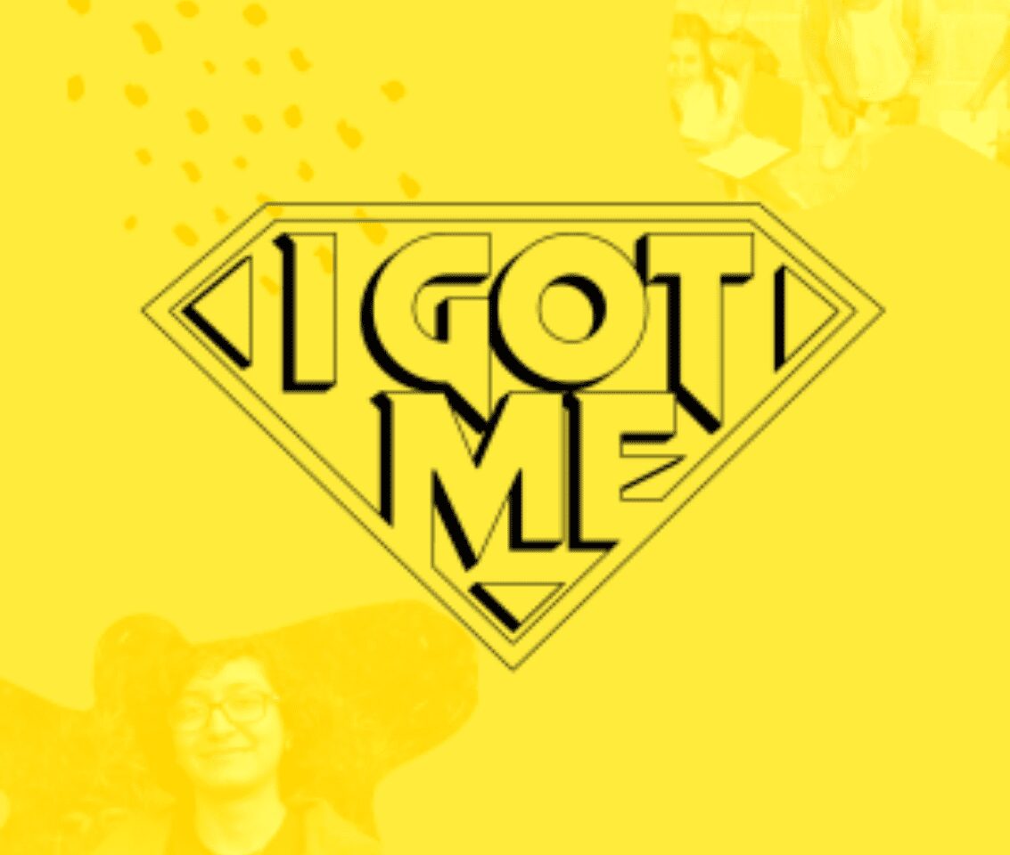 Yellow superhero emblem reading I GOT ME